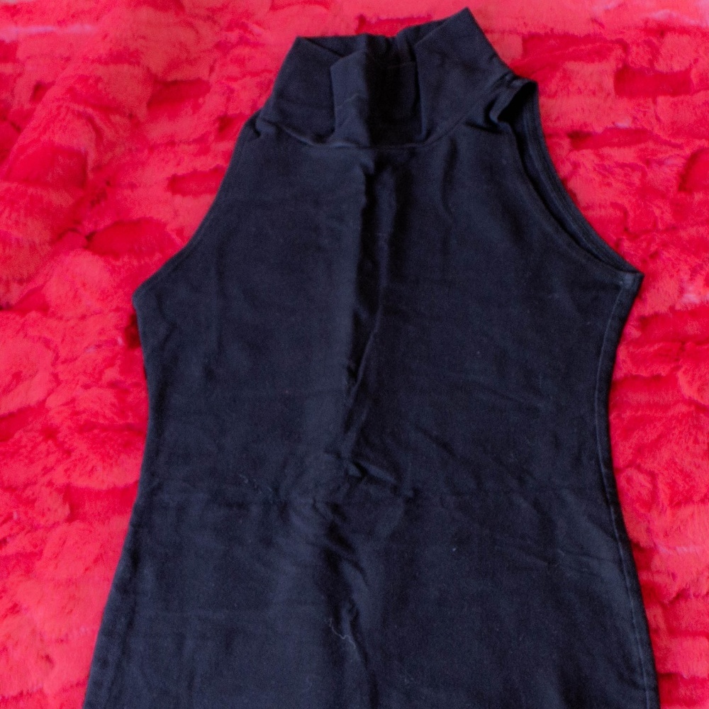 Sleeveless turtleneck body con dress